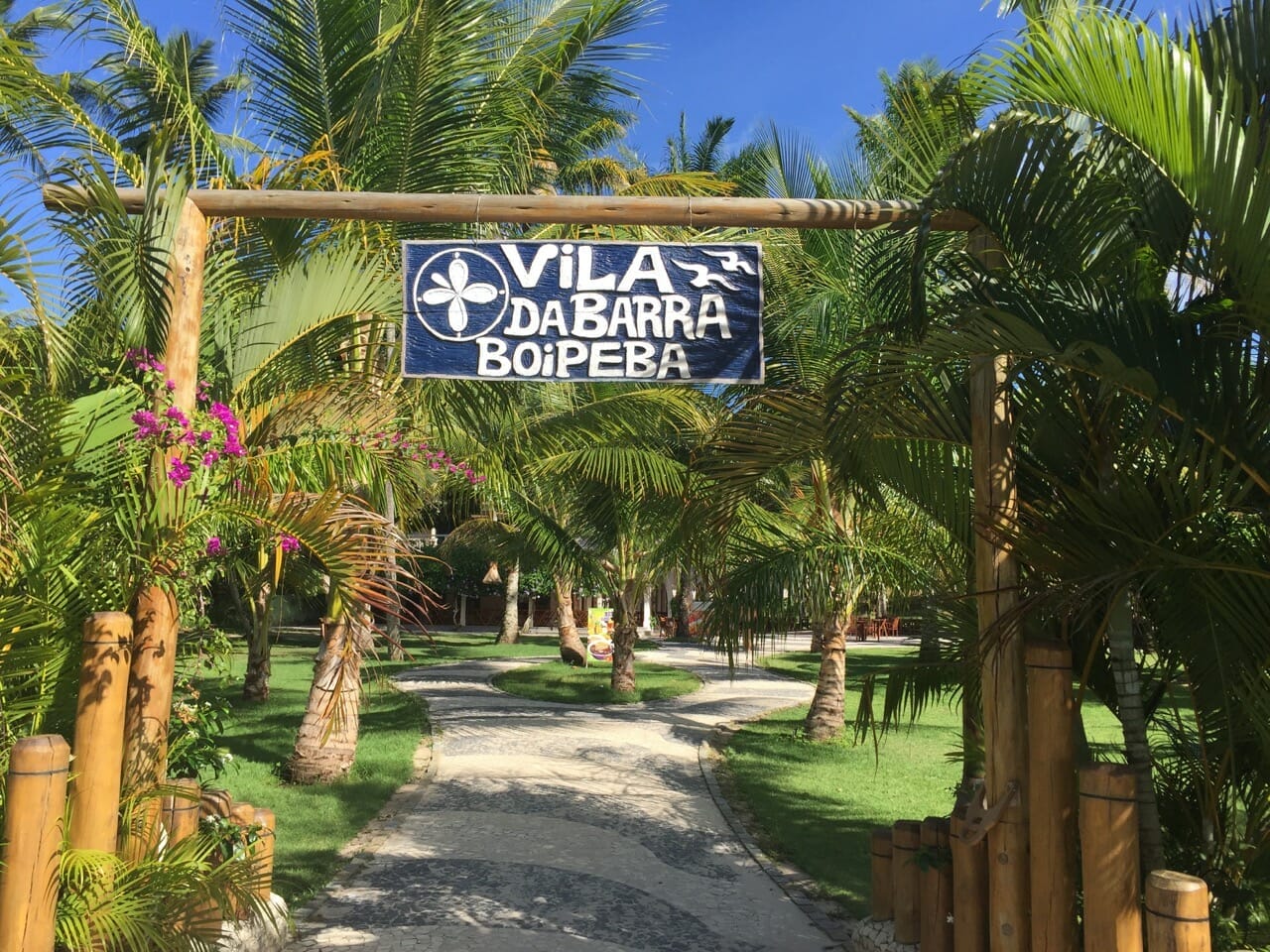 The entrance of Vila da Barra, which is surrounded by coconut tress, Boipeba Island, Bahia, Brazil