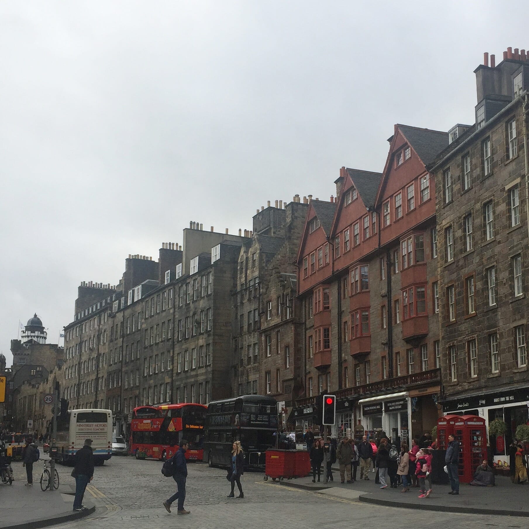 people walking on the street and the beautiful architecture of the Royal Mile in Edinburgh
