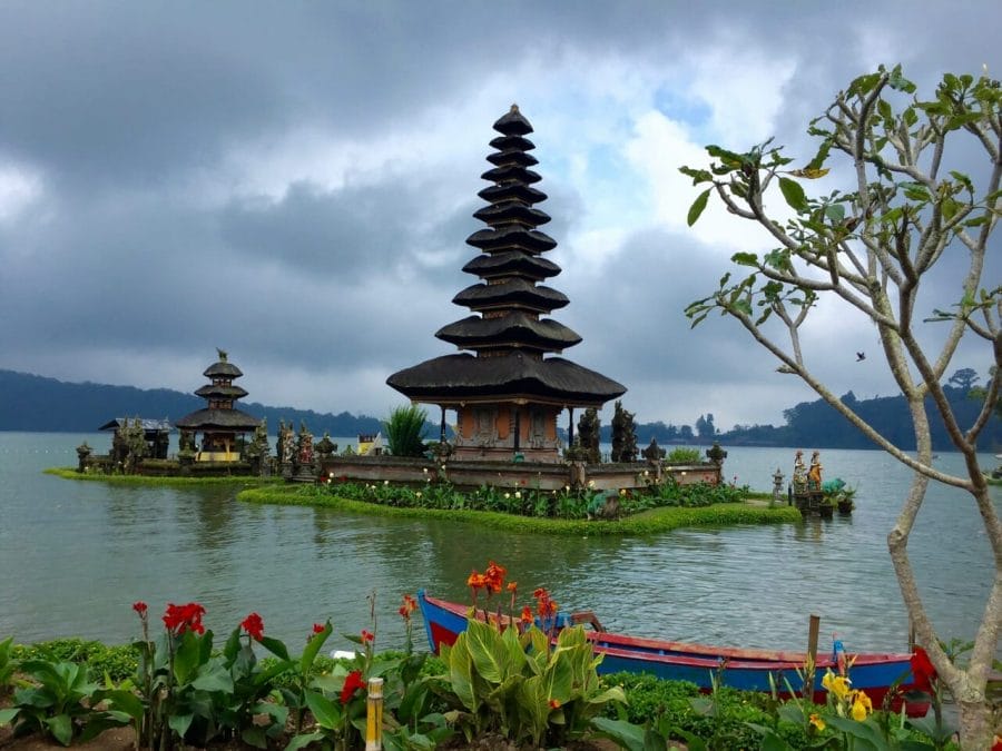 Ulun Danu Beratan Temple and its Buddhist Stupa in Indonesian style surrounded by water of the Lake Bratan, Bali. 