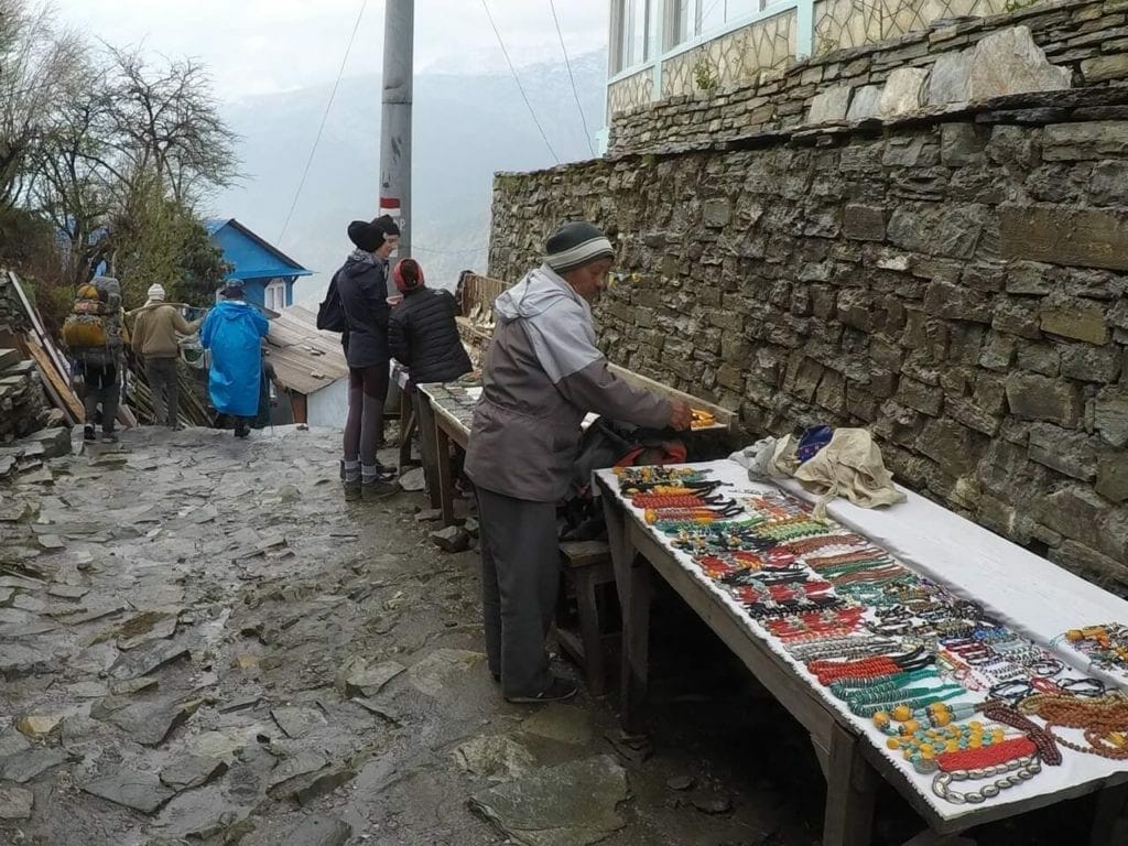 People selling arts and crafts on the main street of Ghorepani, Nepal
