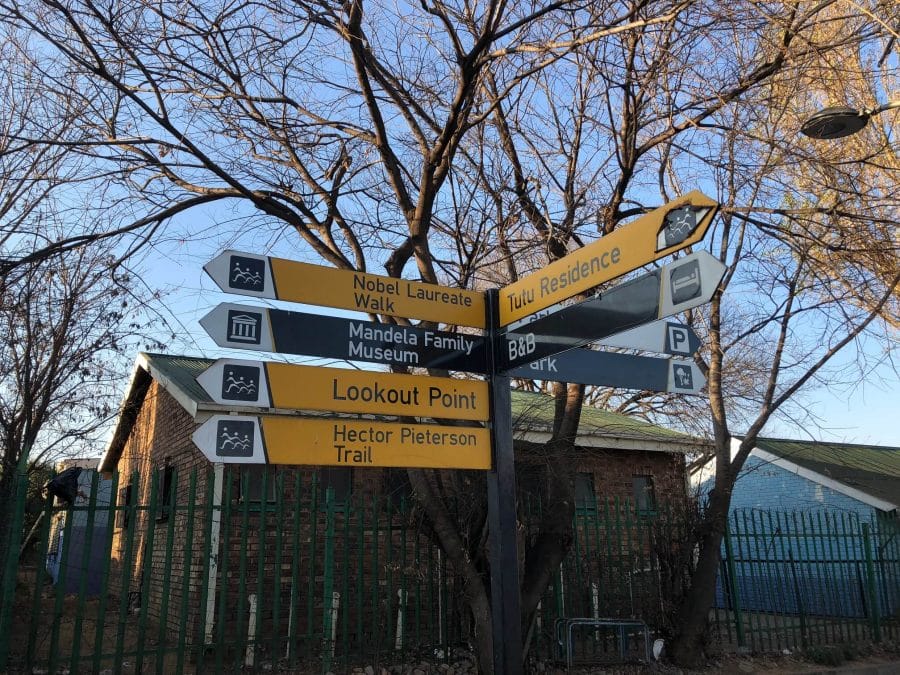 Signs in Soweto showing the directions of Tutu Residence, Mandela Family House, Hector Pieterson Trail, etc.