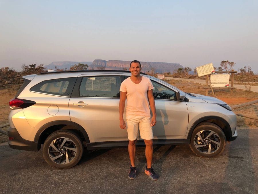 10 Things You Should Know Before Going to South Africa 13 Pericles Rosa and a car behind him at Three Rondavels View Point Souvenir & Parking, South Africa