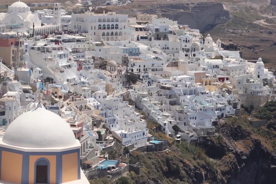 Whitewashed houses atop of a sea cliff in the town of Fira, Santorini.