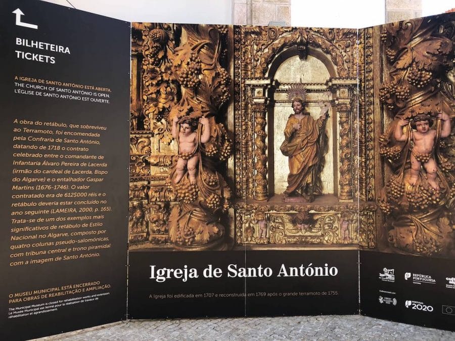 A sign with a picture of the altar of Igreja de Santo Antônio with some information to visit the church, Lagos, Portugal