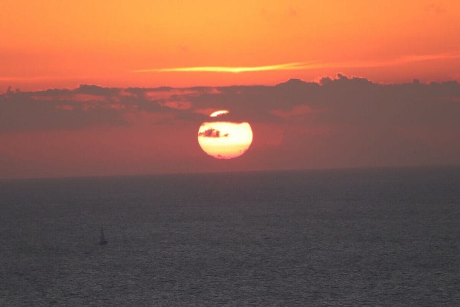 30 Amazing Things to Do in Santorini, Greece 14 The magnificent Santorini sunset from Akrotiri Lighthouse