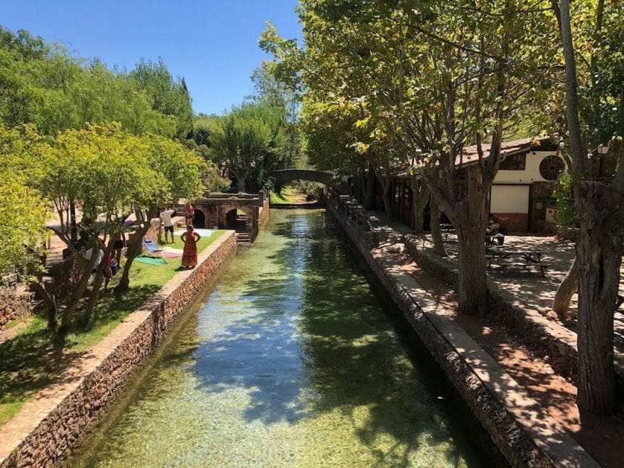 15 Best Algarve Tours, Activities & Excursions For An Unforgettable Trip 11 A natural pool in Alte, Algarve, that has translucid water and is surrounded by trees