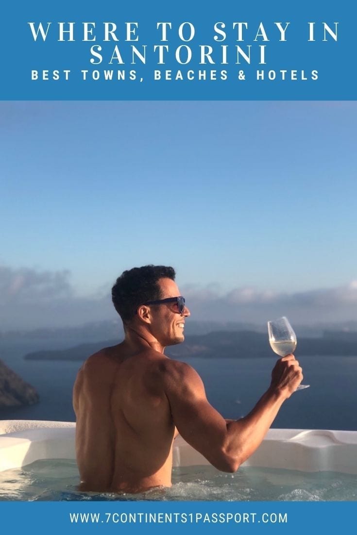 Where to Stay in Santorini: A Guide to the Best Places 26 a man wearing sunglasses holding white wine glass in a jacuzzi of a hotel in Imerovigli, Santorini