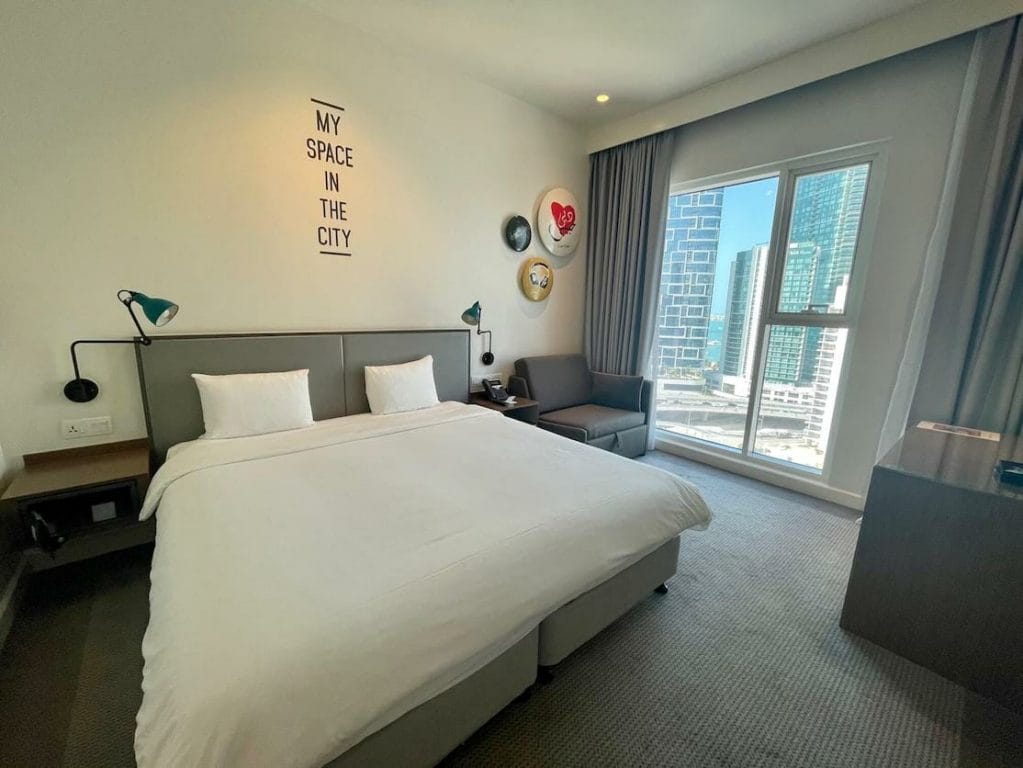 A double-bed room with a marina view at Rove Dubai Marina Hotel