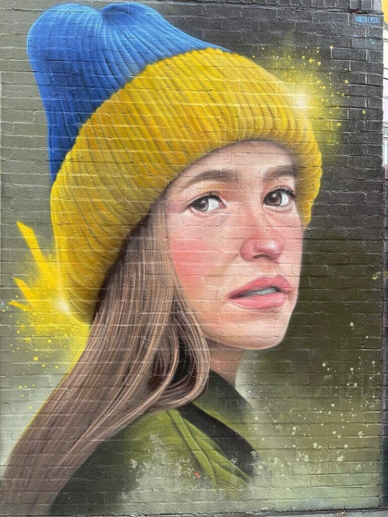 A photo-realistic portrait mural by Woskerski on Redchurch Street, London