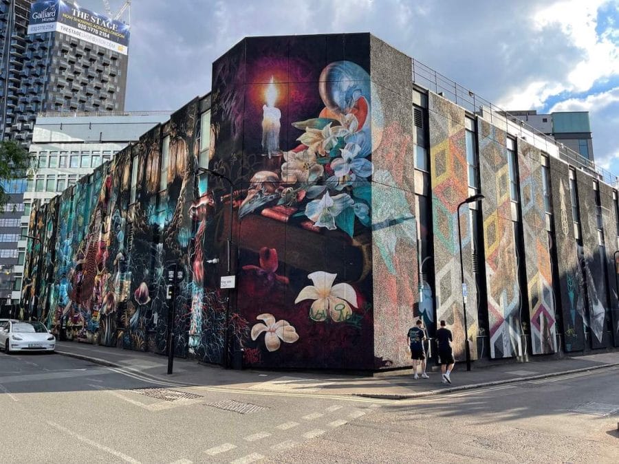 Colt Technology’s London Head Quarter building on New Inn Yard and King John Court covered with a huge street art mural
