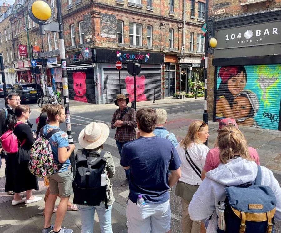 Some people joining a Shoreditch Street Art Tour on Brick Lane, London
