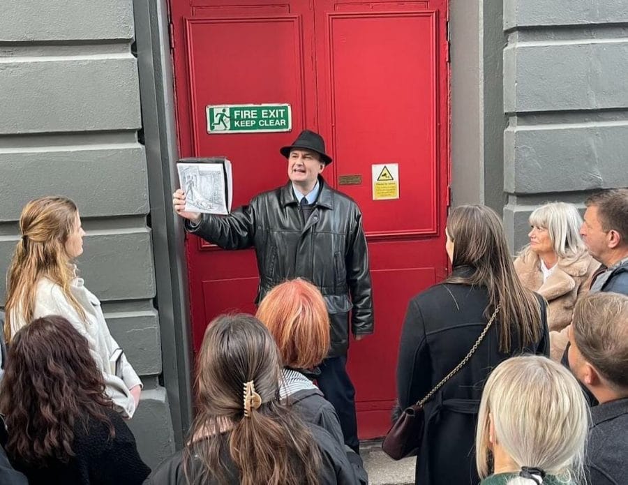 Following the Footsteps of Jack the Ripper - World’s Most (In)Famous Serial Killer 2 A tour guide is showing a picture of a police man finding the body of Jack the Ripper's first victim