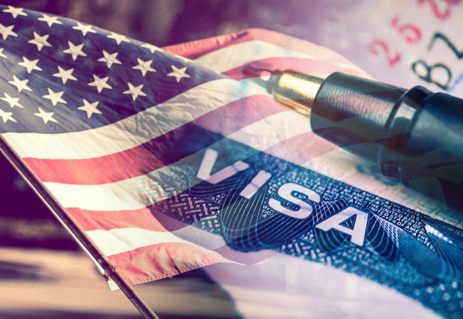 The USA flag with "Visa" overwritten on it and a pen