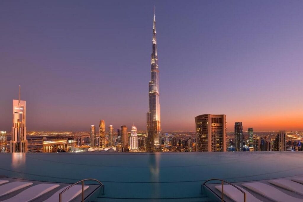 The infinity swimming pool with a view to the Burj Khalifa and Downtown Dubai at Address Sky, Dubai