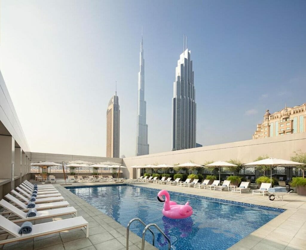 The swimming pool and the sundeck with the Burj Khalifa in the backdrop at Rove Downtown, Dubai